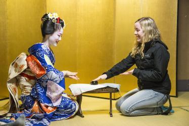 Playing drinking games with a maiko in a yellow room in Kyoto 