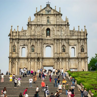 People climbing steps up to St Paul's church 