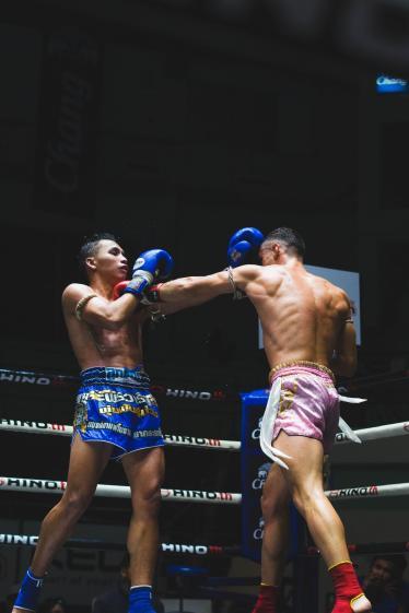 Muay Thai boxers competing in the ring in Bangkok
