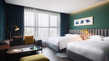 Interior of a double bedroom in RYSE Autograph hotel, Seoul 