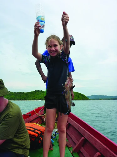 Girl on a fishing boat in Burma