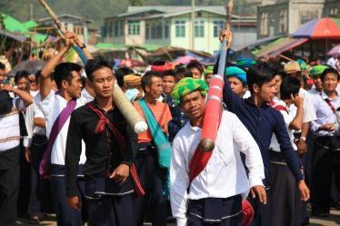 (High school student and his teacher carrying firecrackers)