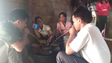 Barci ceremony with villagers drinking rice wine in Laos
